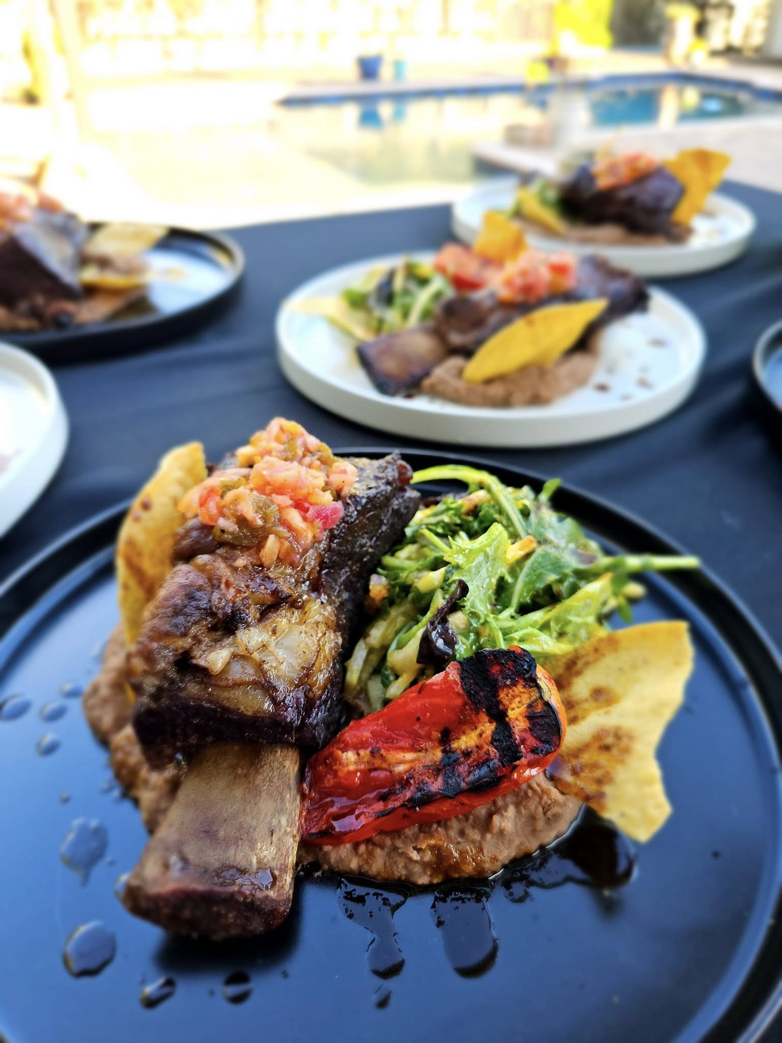 Gourmet short rib dish with fresh garnishes - Private Chef Jacksonville